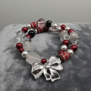 Elegant Silver and Red Beaded Bracelet with Bow Charm